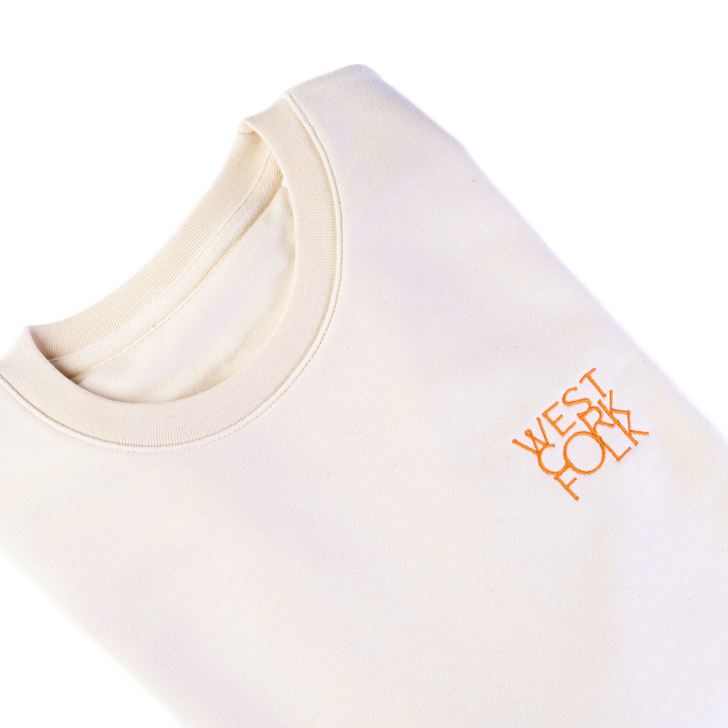 Beige sweater with 'West Cork Folk' logo on a white background