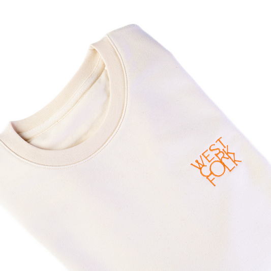 Beige sweater with 'West Cork Folk' logo on a white background
